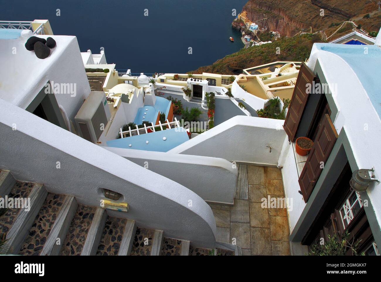 A view of part of the Greek Island of Santorini on a sunny day, looking down toward the Mediterranean Sea. Stock Photo