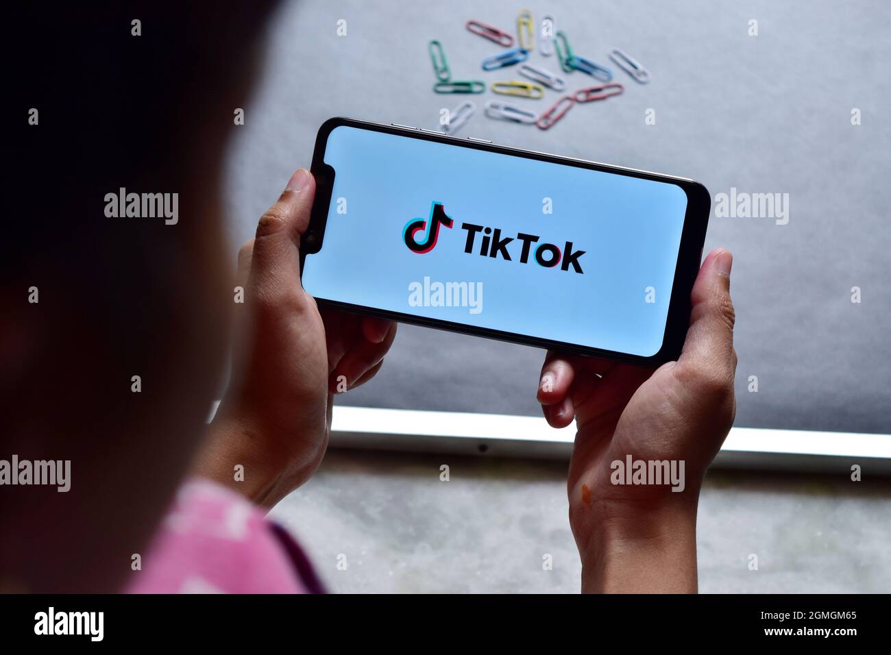 INDIA, DELHI - October 19, 2019: Using Tiktok Application on Smartphone Stock Photo