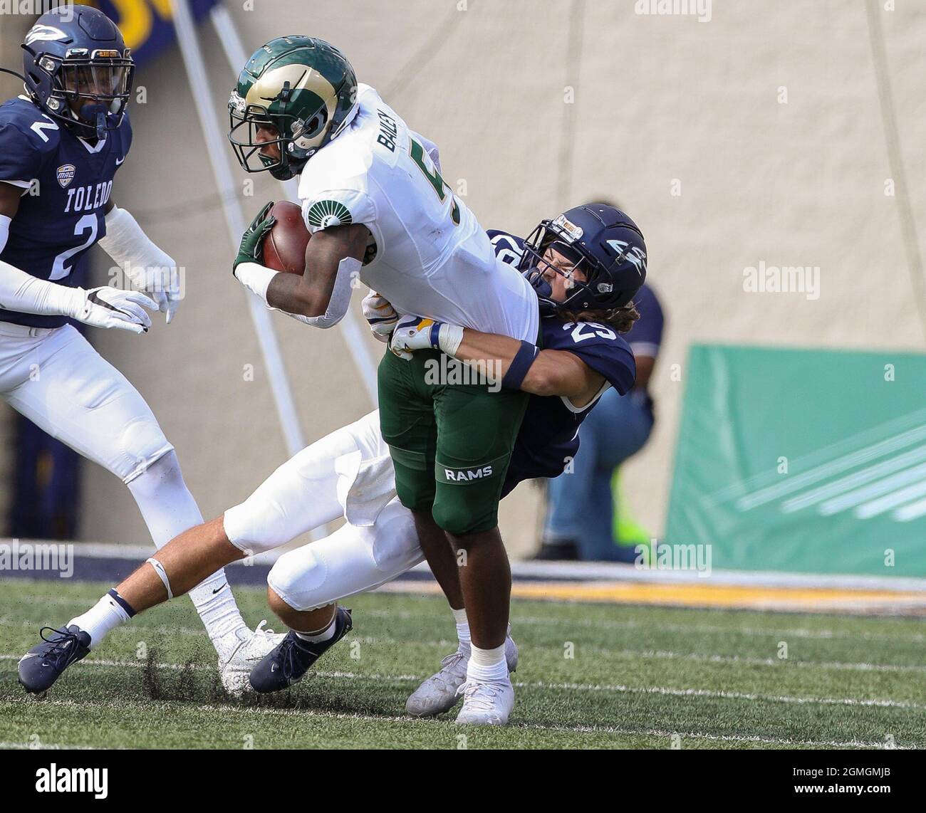 Toledo, OH, USA. 18th Sep, 2021. Toledo's Maxen Hook #25 tackles Colorado State's David Bailey #5 during the NCAA football game between the Toledo Rockets and the Colorado State rams at the Glass Bowl in Toledo, OH. Kyle Okita/CSM/Alamy Live News Stock Photo
