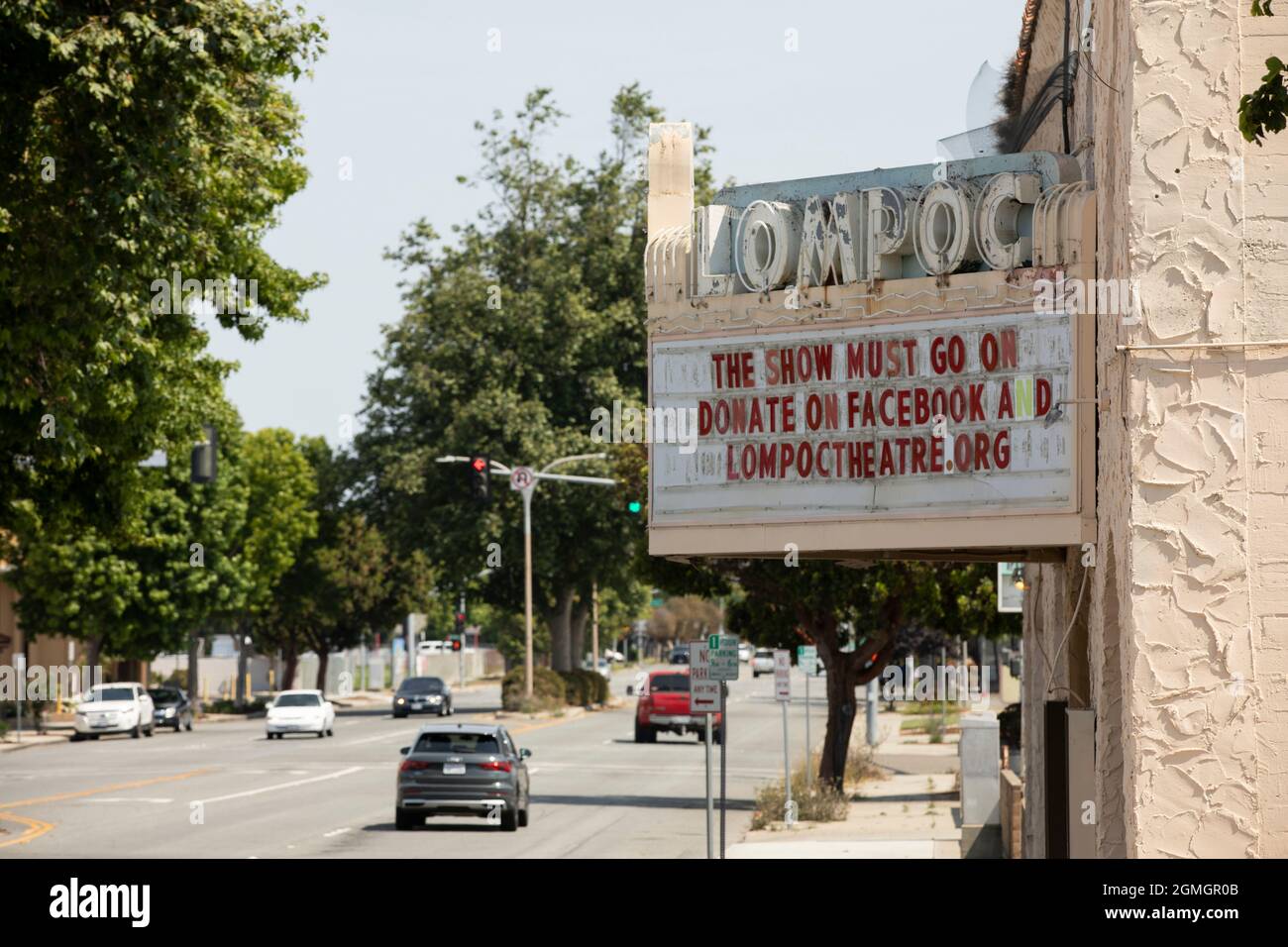 Lompoc, California, USA - July 25, 2021: Midday sun shines on the historic downtown Lompoc Theatre. Stock Photo