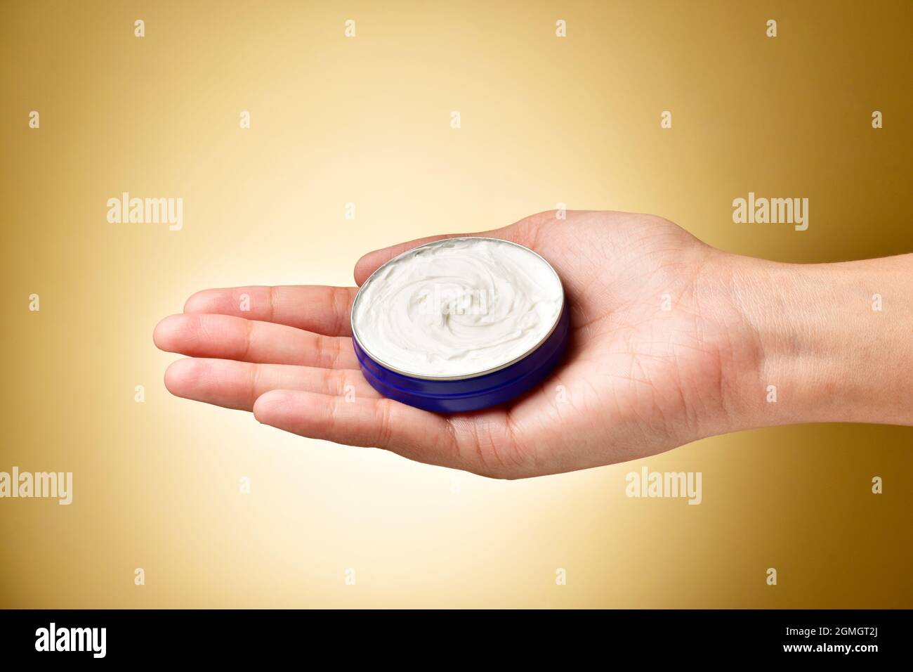 cosmetic cream container in Hand Stock Photo Alamy