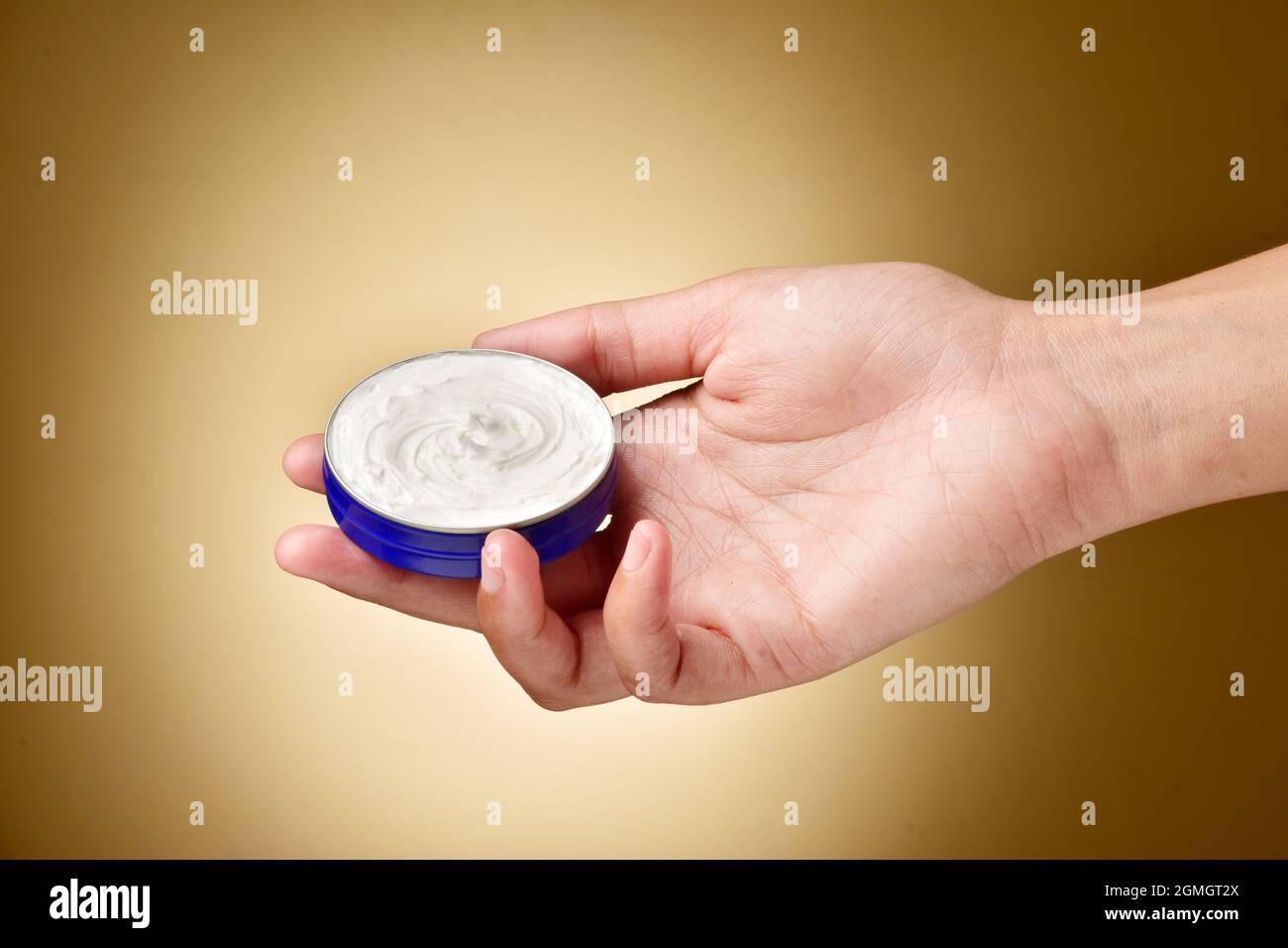 Hand Holding Moisturizer Cream Container Stock Photo Alamy