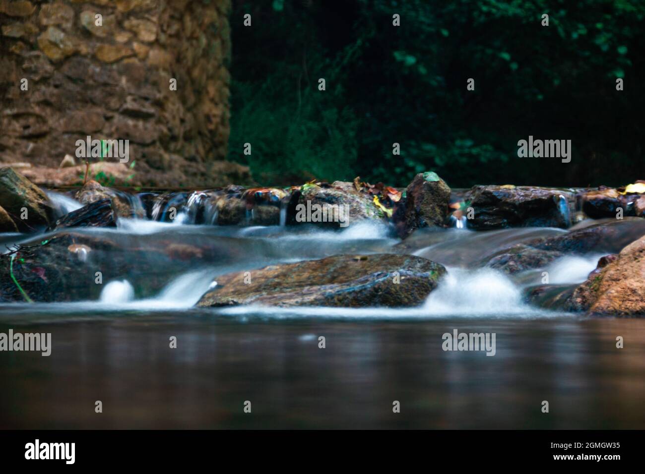 A scenic waterfalls in the middle of the forest Stock Photo - Alamy