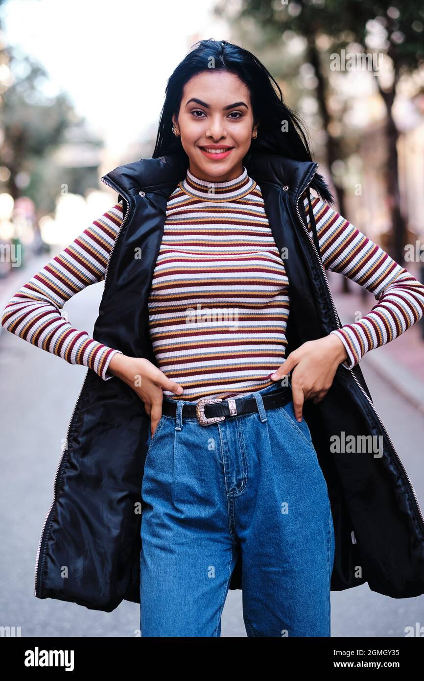 young moroccan girl with short hair with fall outfit - fall concept Stock Photo