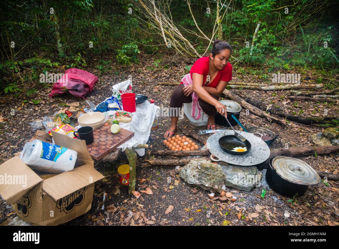 LISETTE COOKING IN EL GUIRO CAMP IN WAKNA, TREK TO EL MIRADOR, PETEN