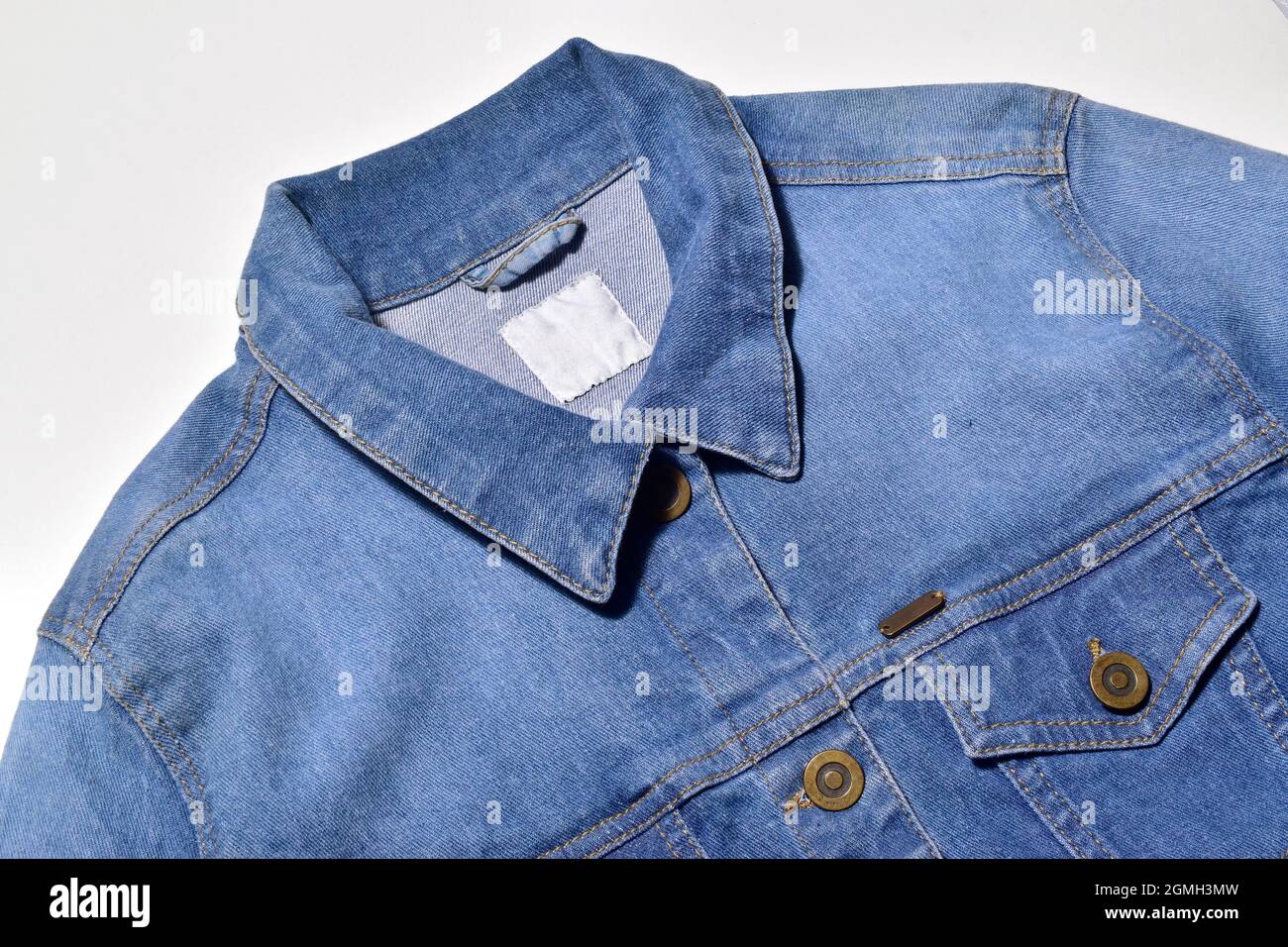 Closeup of Blue Denim Jacket Isolated on White Background with Clipping  Path Stock Photo