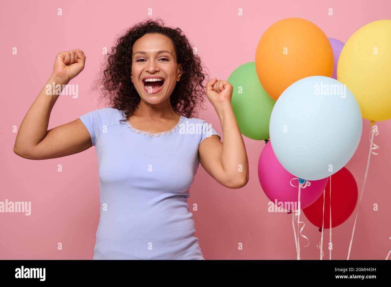 Carefree woman dances against background hi-res stock photography and ...