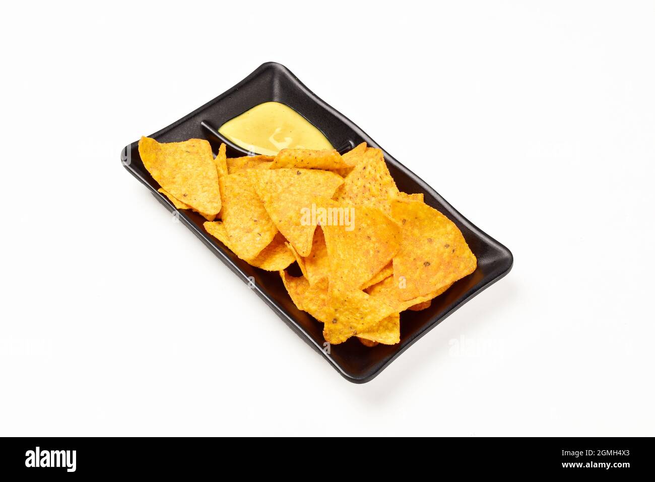 Nacho Chips with Mustard Dipping in Plate Isolated on White Background