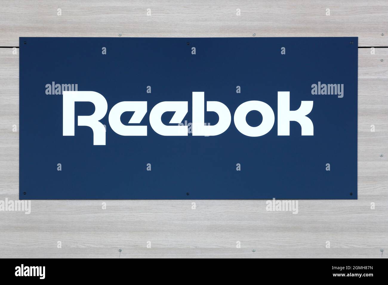 Villefranche, France - May 17, 2020: Reebok logo on a wall. Reebok is a global athletic footwear and apparel company Stock Photo
