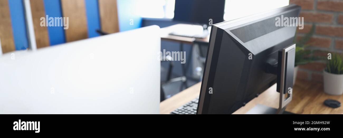 Many computers standing on table in empty classroom Stock Photo - Alamy