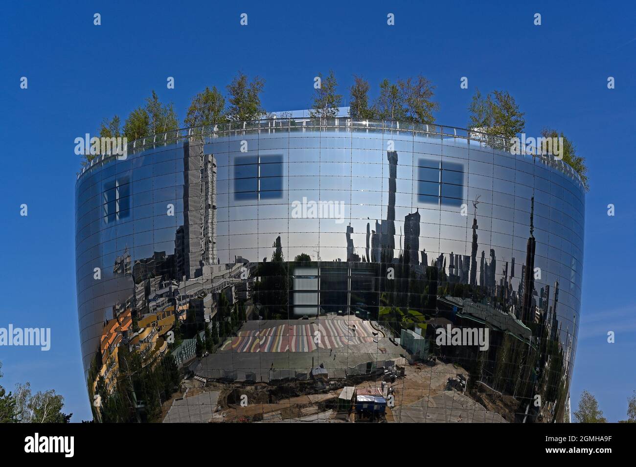 rotterdam /netherlands - 2021-09-05:   round facade of the depot newbuilding of museum boijmans van beuningen reflecting the nearby cityscape --  [cre Stock Photo