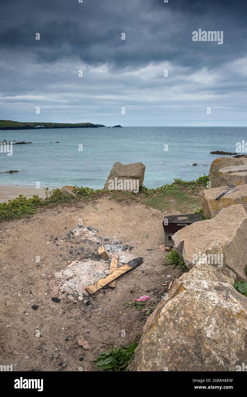 Damage caused to the coastal habitat by camp fires and barbeques lit by careless and unthinking visitors at Little Fistral in Newquay in Cornwall. Stock Photo