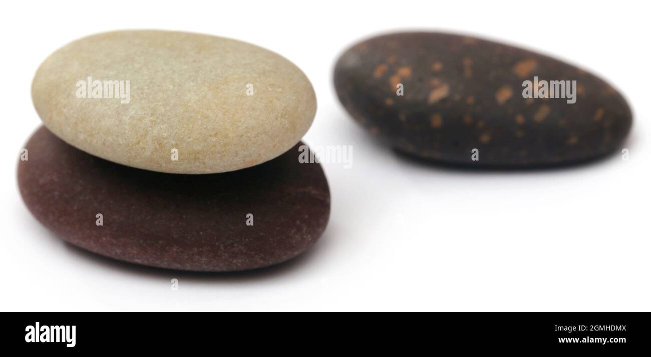 Massage stone isolated over white background Stock Photo - Alamy