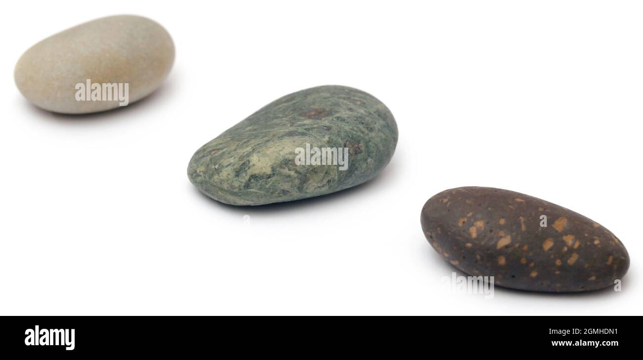 Massage stone isolated over white background Stock Photo - Alamy