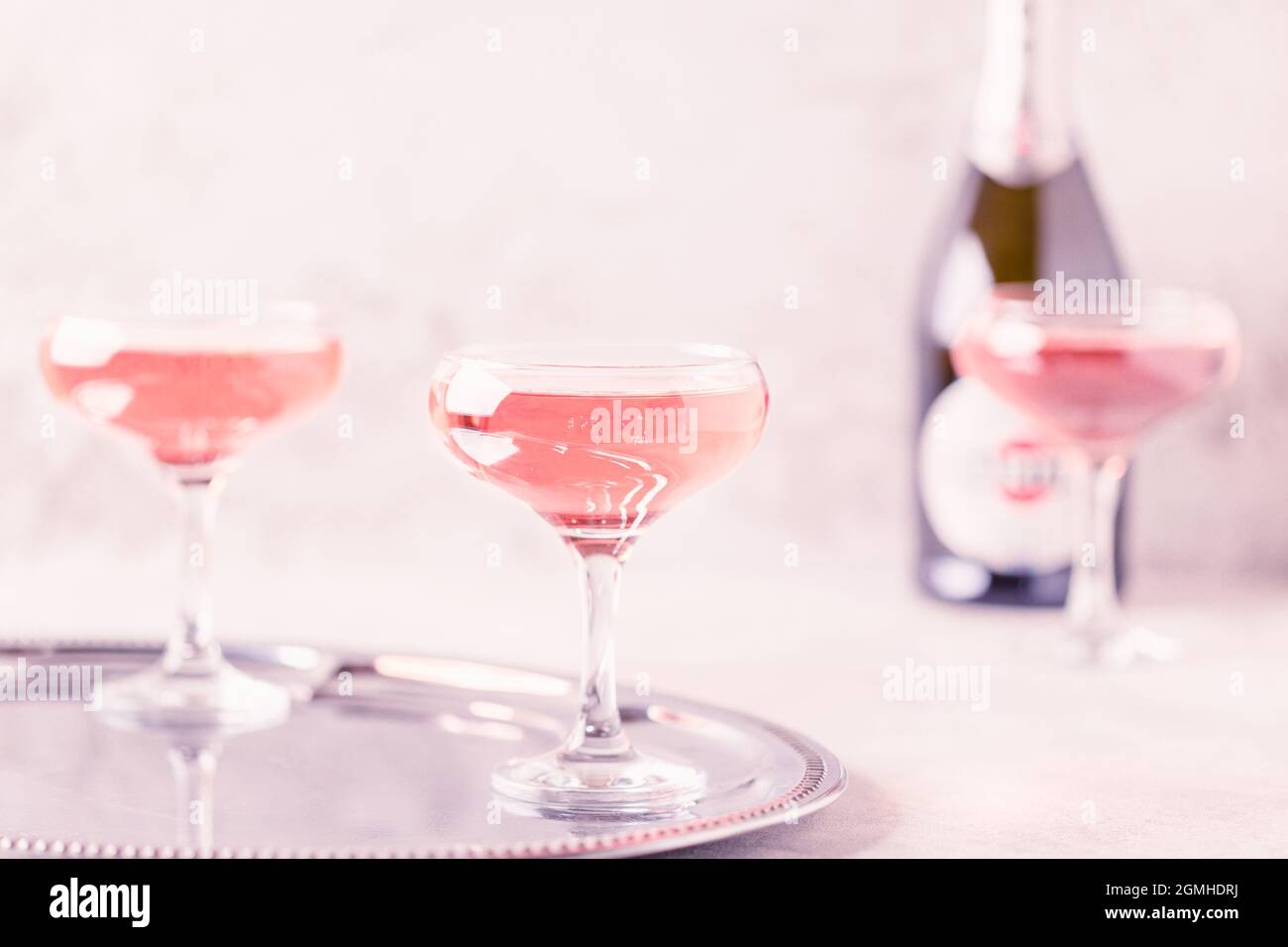 Champagne or wine in glasses on light background. Copy space. Stock Photo
