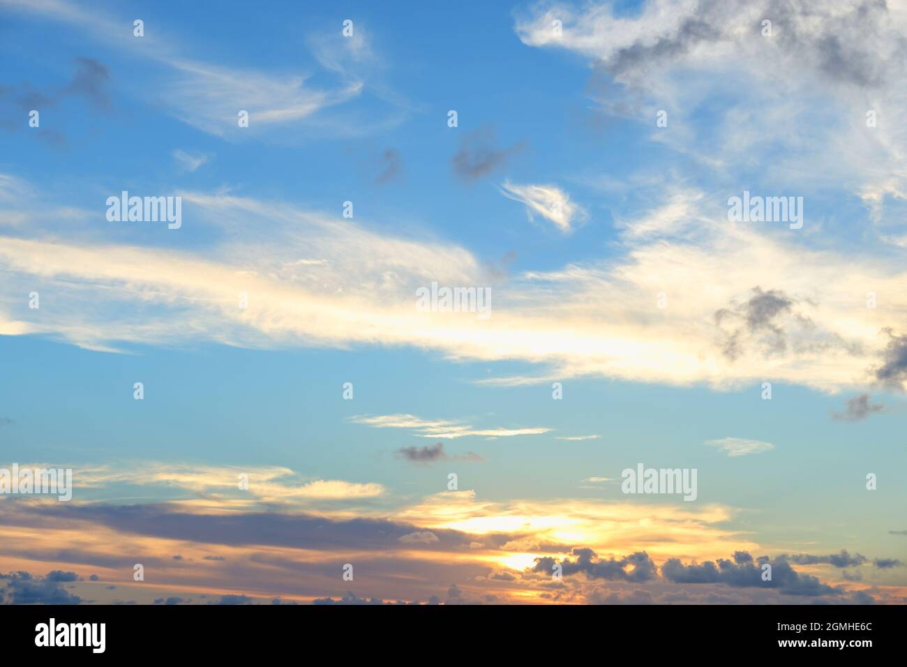 Beautiful colored cloudy evening sky. Sky with clouds at sunset. Abstract sky background. Stock Photo