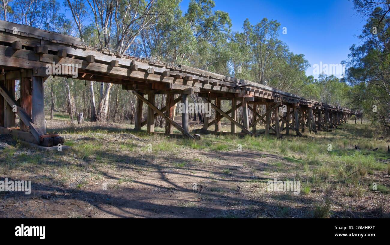 Old railway trestle bridge in the sunlight in rural New South Wales Australia Stock Photo