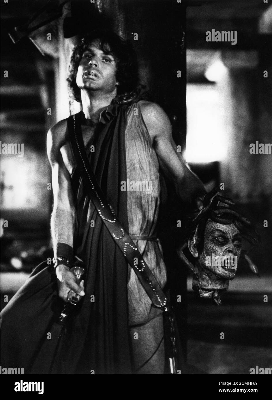 HARRY HAMLIN as Perseus holding the severed head of Medusa the Gorgon in CLASH OF THE TITANS 1981 director DESMOND DAVIS written by Beverley Cross costume design Emma Porteous creator of special visual effects (Dynamation) Ray Harryhausen music Laurence Rosenthal producers Charles H. Schneer and Ray Harryhausen Charles H. Schneer Productions / Peerford Ltd. / distribution Cinema International Corporation (CIC)  (UK) Metro Goldwyn Mayer (USA) Stock Photo