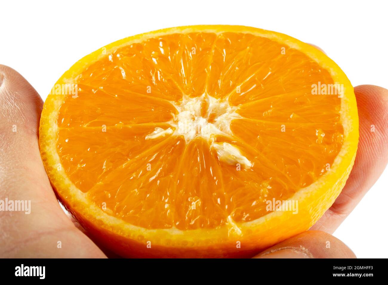 orange slice in hand - isolated on white background Stock Photo - Alamy