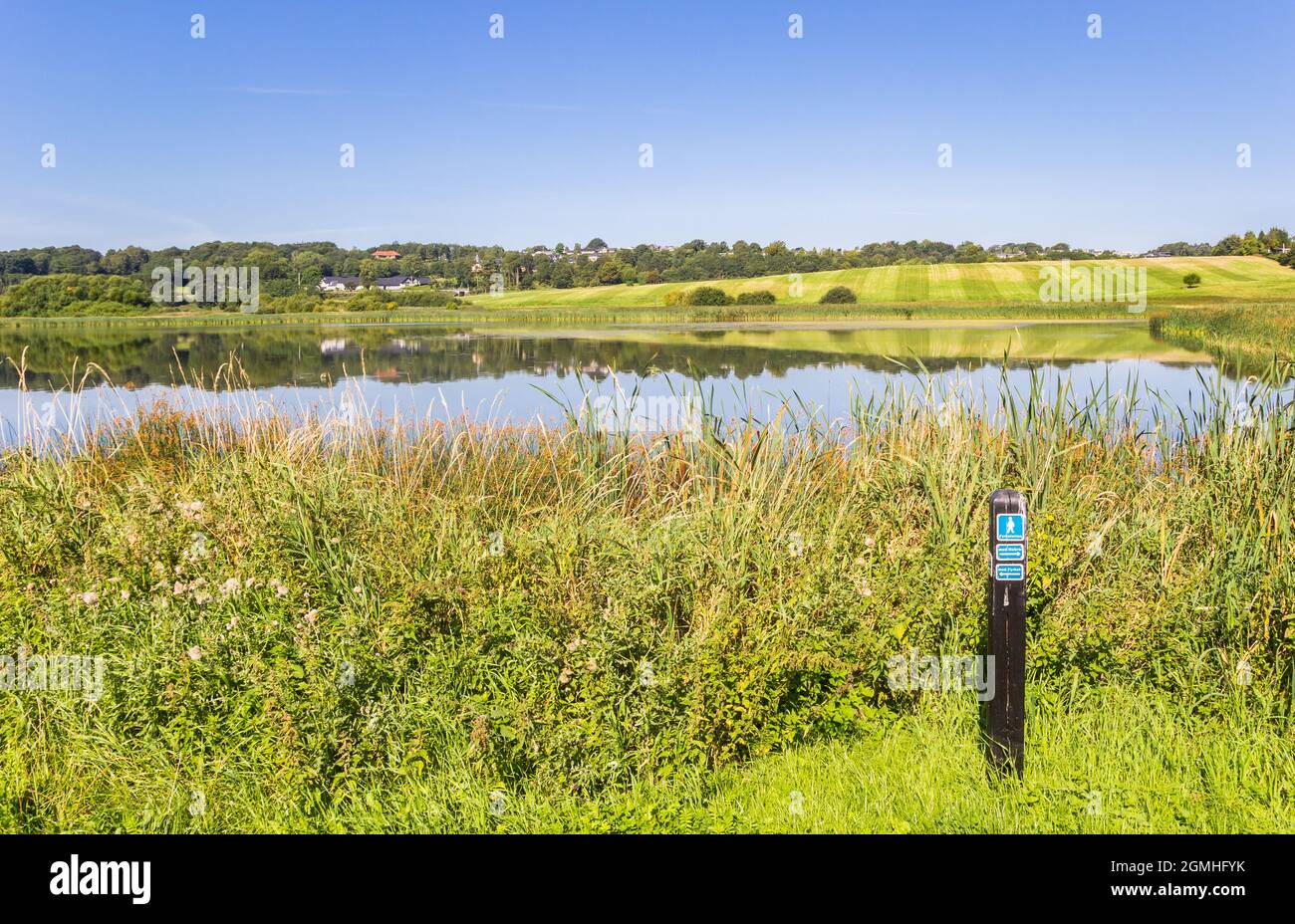 Tourist sign for walking directions at the lakeside in Hobro, Denmark Stock Photo
