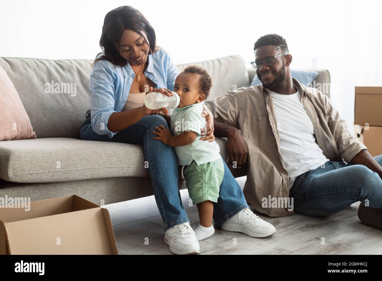 Happy African American family moving in new apartment Stock Photo - Alamy
