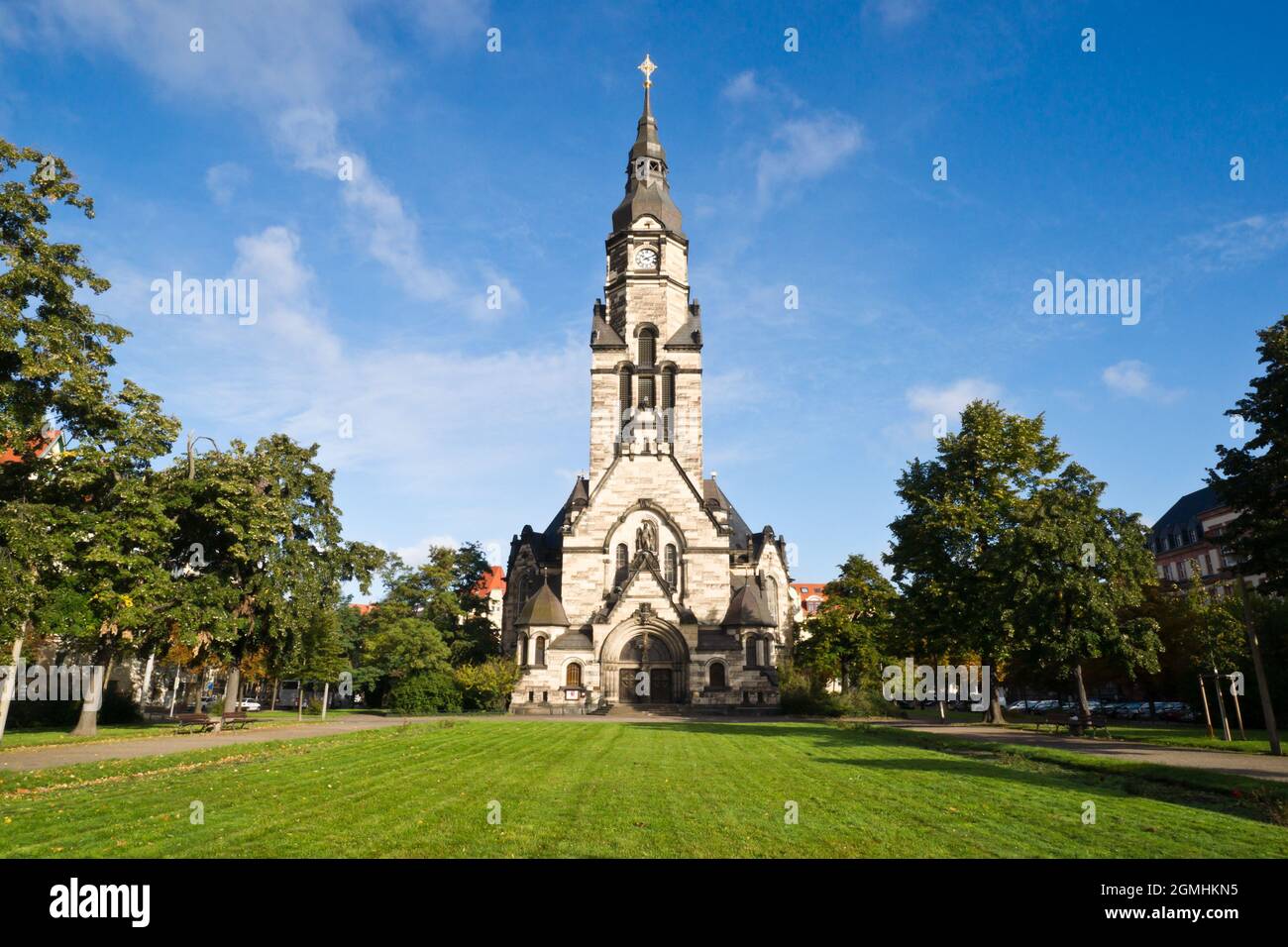 View of the Michaeliskirche in Leipzig/Germany suurounded by a little park. The 70m high building shows architectonic elements of different styles. Stock Photo