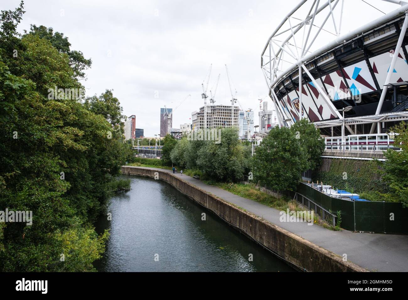 UAL’s London College of Fashion under construction, East Bank, with the London Stadium and river Lea, Queen Elizabeth Olympic Park, Stratford, UK, Stock Photo