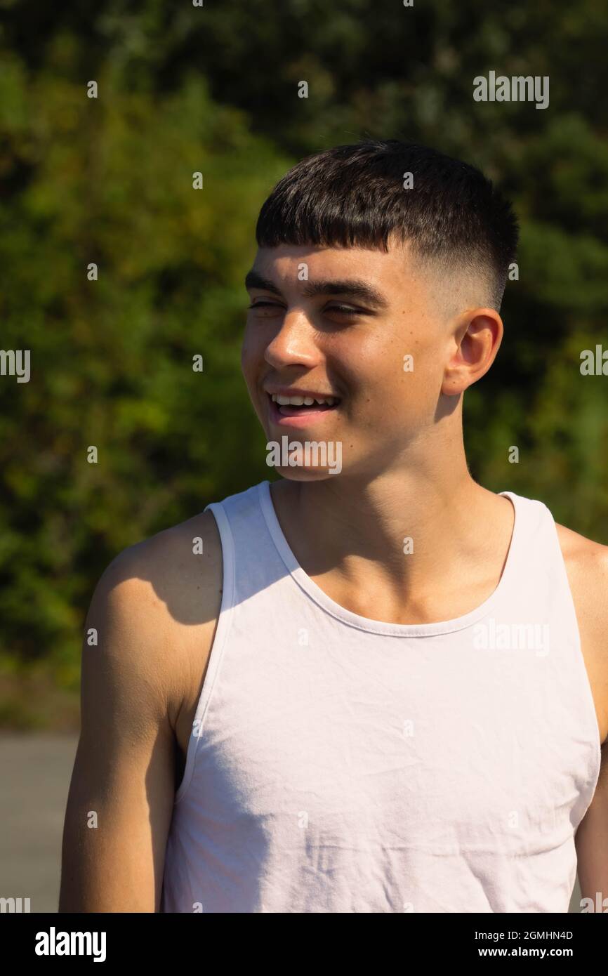 An 18 Year Old Teen Boy In A Sleeveless Top On A Late Summer S Day Stock Photo Alamy