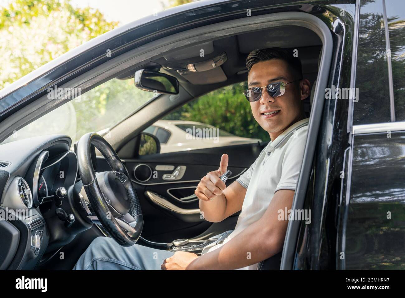 Asian businessman driving car hi-res stock photography and images - Alamy