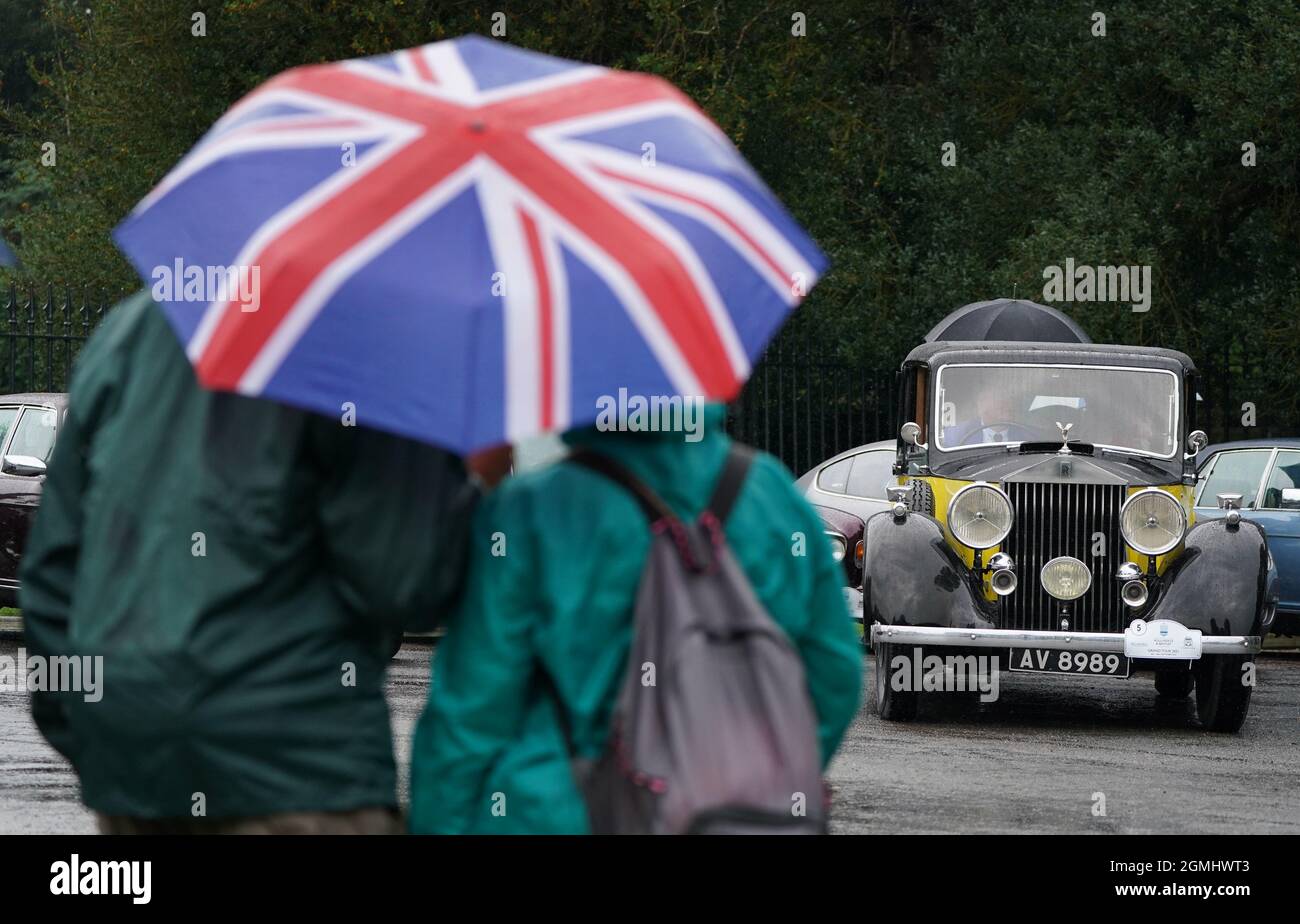 People look on as a 1937 Rolls-Royce Park Ward Limousine parks up in front of Windsor Castle as it [joins other classic cars belonging to members of the International Club for Rolls Royce and Bentley Enthusiasts as they make their way the Long Walk during an escorted parade through the Great Park to Windsor Castle in aid of The Prince Philip Trust Fund. Picture date: Sunday September 19, 2021. Stock Photo