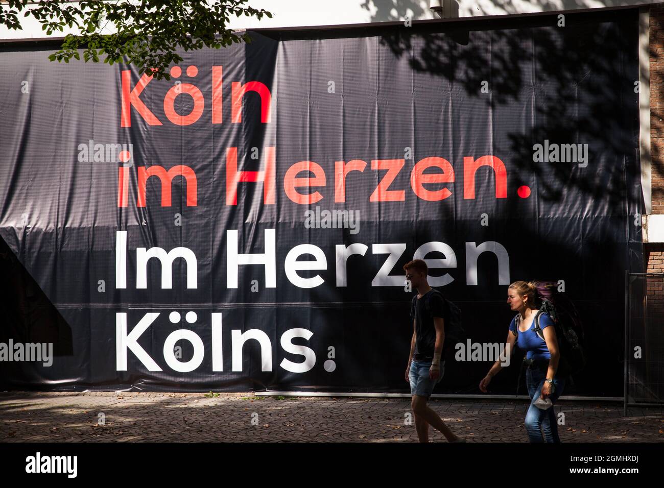 poster advertising the Laurenz-Carré construction project in the city near the cathedral, Cologne, Germany. Translation: Cologne in the heart, in the Stock Photo