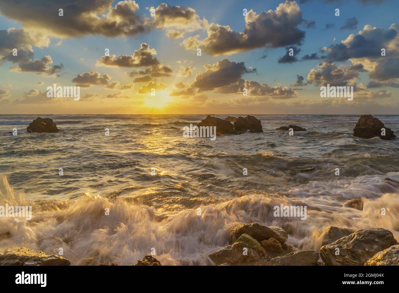 Waves rolling down the shore in a very beautiful evening on the Mediterranean, Israel Stock Photo