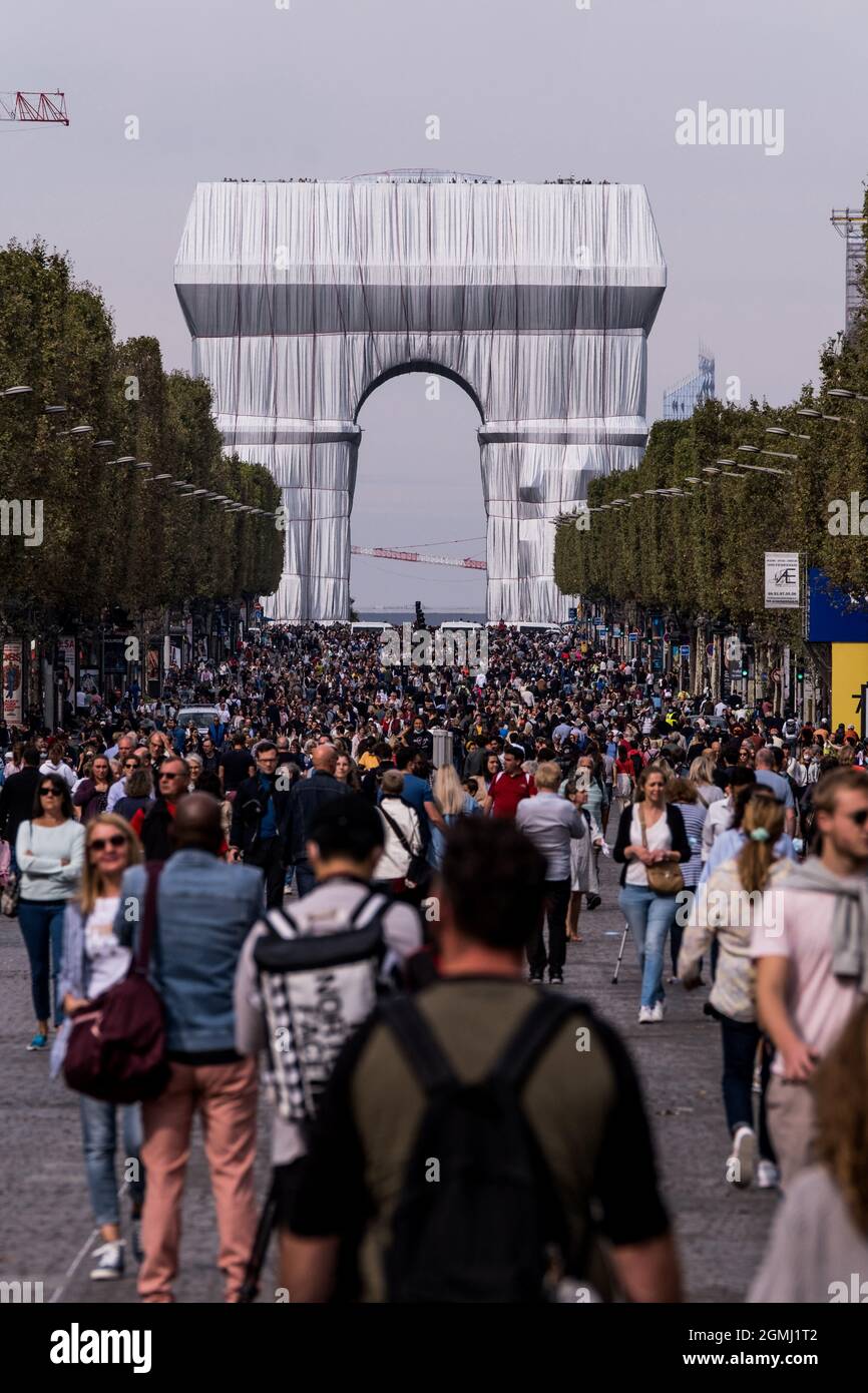 Paris, France. 19th Sept 2021. People visit the art installation featuring  the Arc de Triomphe wrapped in a giant sheet of fabric as part of a project  of late Bulgarian-born US artist