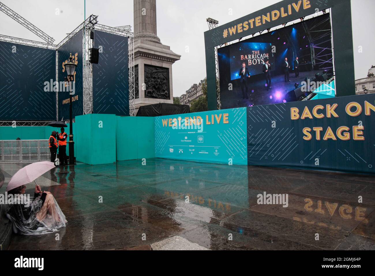 London UK Sunday 19 September 2021 Not even the rain could persuade this die hard fan of west en musicals, to move from Trafalgar square were the West Live show was going on this week end . Credit: Paul Quezada-Neiman/Alamy Live News Stock Photo