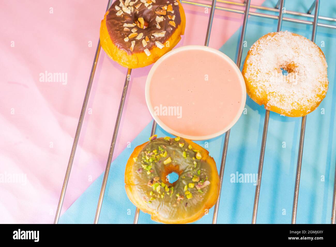 A top view of colorful tasty doughnuts on a metal net Stock Photo - Alamy