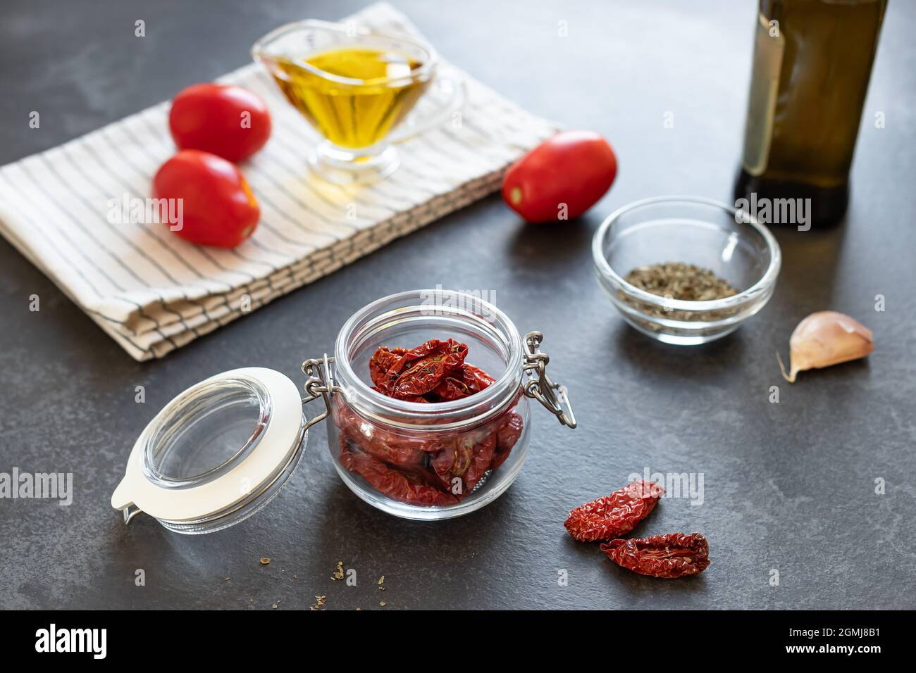 Sun dried tomatoes on dark kitchen counter Stock Photo Alamy
