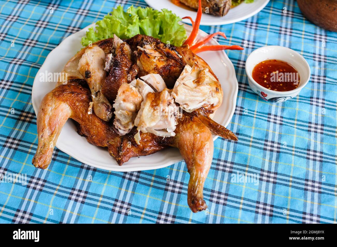 thai style roasted chicken served with spicy sauce Stock Photo - Alamy