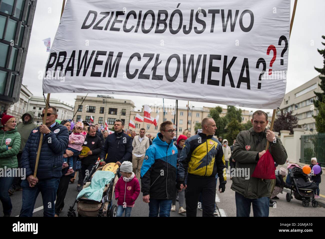 Warsaw, Poland. 19th Sep, 2021. Marchers hold a banner that says Is infaticide human's right? during the demonstration.Thousands of people took part in the XVI National March of Life and Family (Narodowy Marsz Zycia i Rodziny) in Warsaw which was held under the slogan 'Dad - be, lead, protect'. As the organizers of the event announced earlier, it was aimed at manifesting pro-family attitudes and pro-life values. The event's main organizer was the Center of Life and Family. Credit: SOPA Images Limited/Alamy Live News Stock Photo