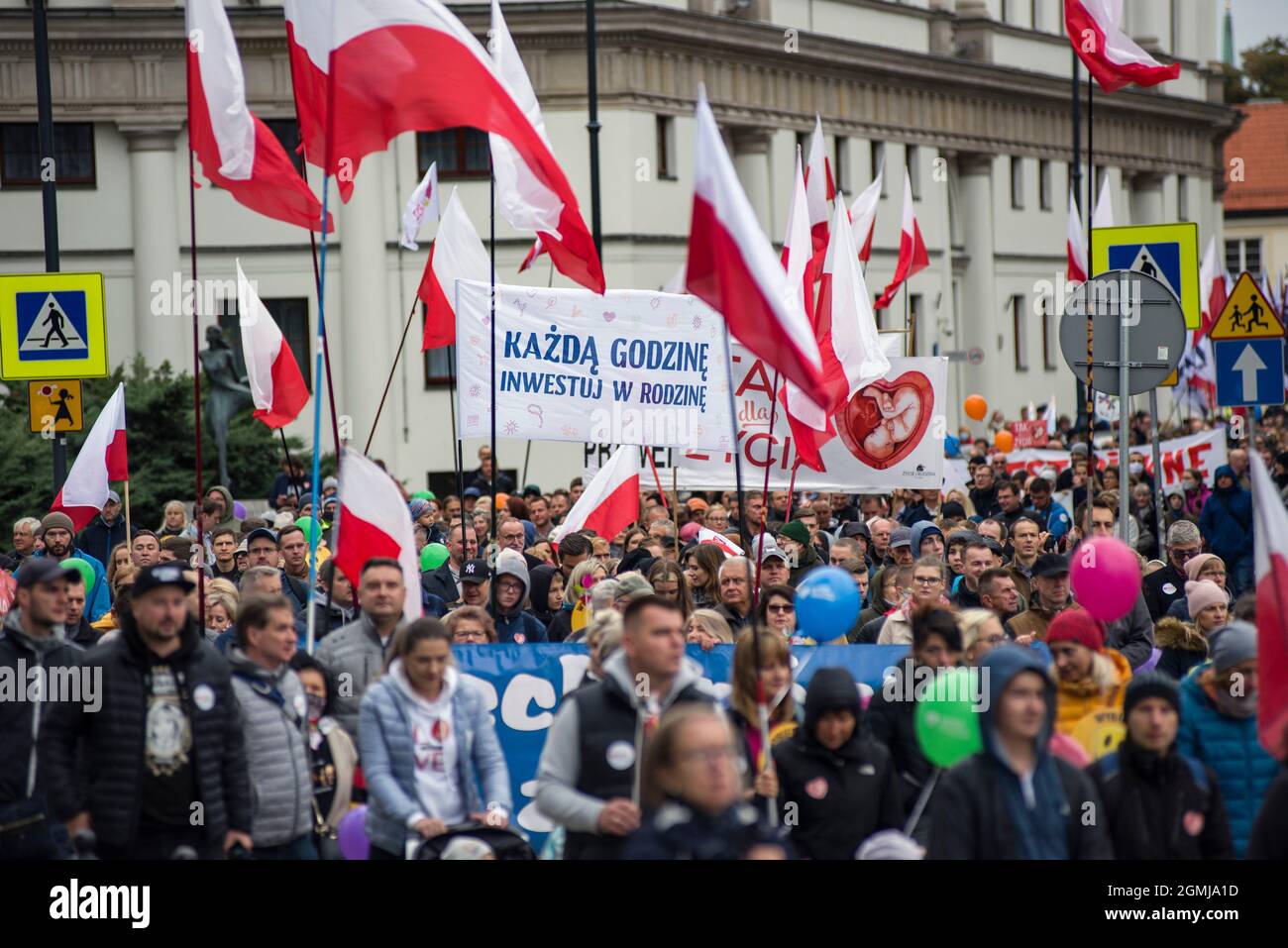Warsaw, Poland. 19th Sep, 2021. Marchers wave flags during the demonstration.Thousands of people took part in the XVI National March of Life and Family (Narodowy Marsz Zycia i Rodziny) in Warsaw which was held under the slogan 'Dad - be, lead, protect'. As the organizers of the event announced earlier, it was aimed at manifesting pro-family attitudes and pro-life values. The event's main organizer was the Center of Life and Family. Credit: SOPA Images Limited/Alamy Live News Stock Photo