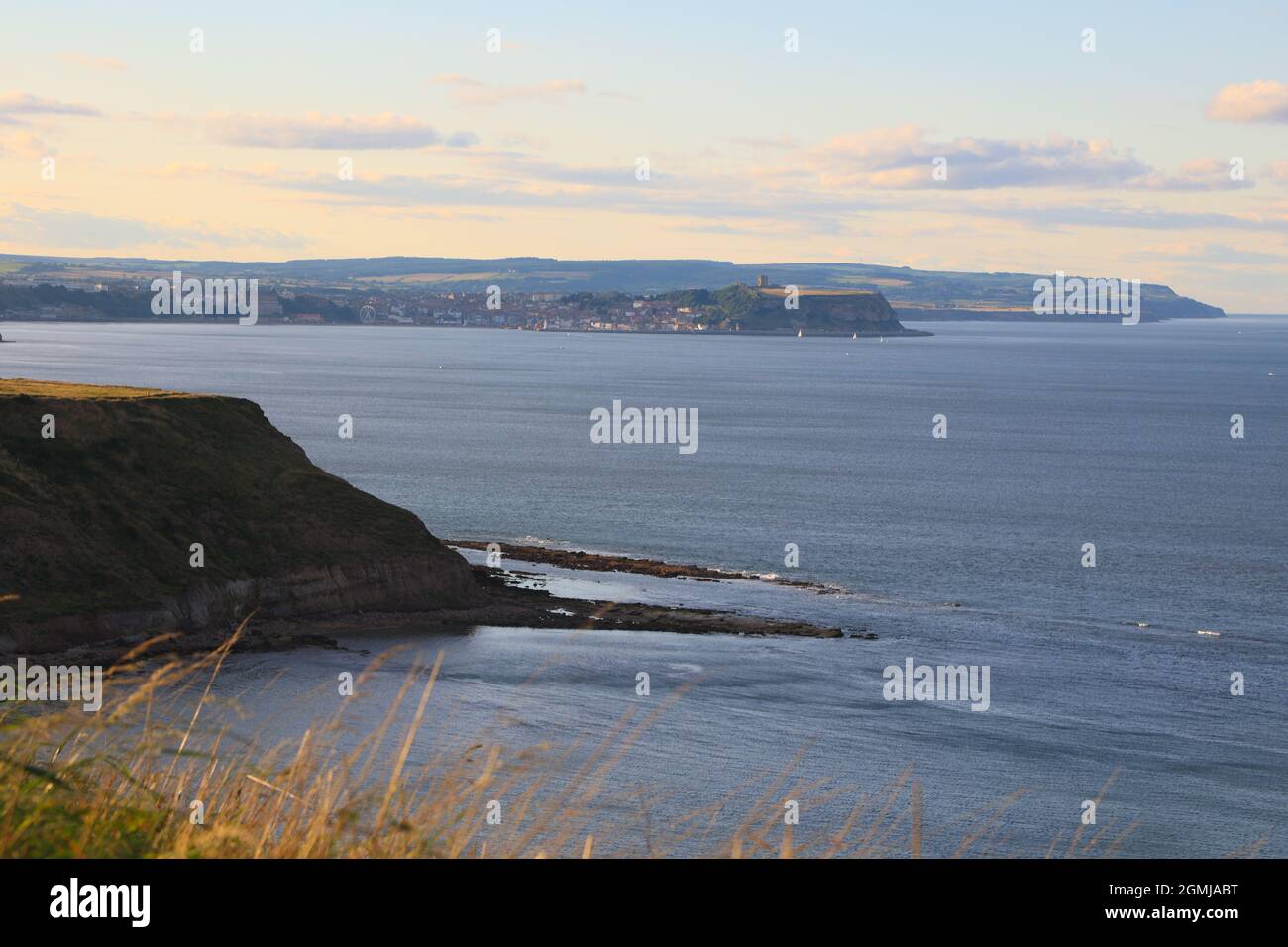Cleveland Way  with Scarborough in the distance looking out over the sea. Stock Photo
