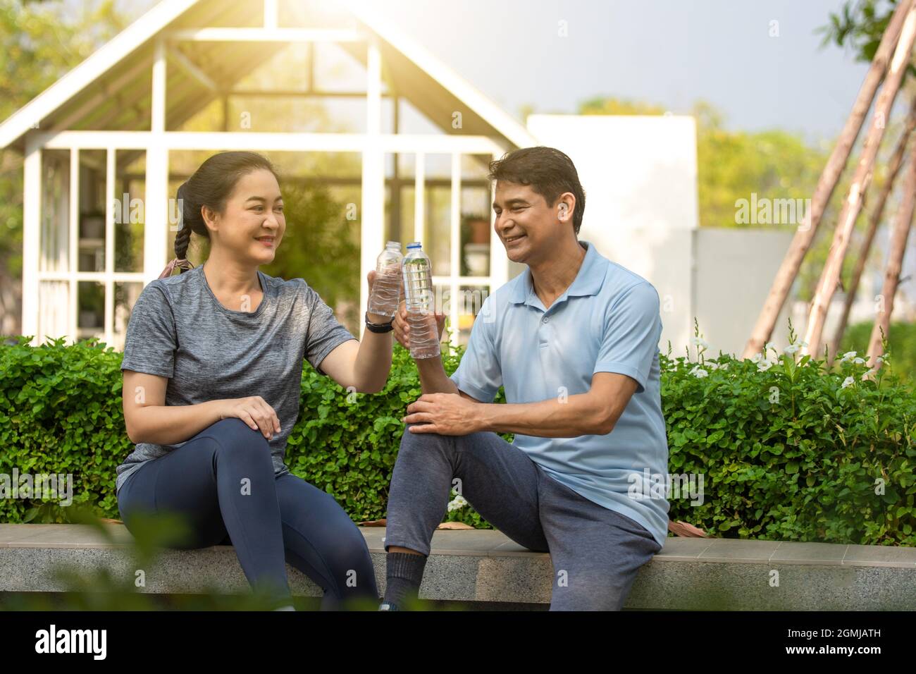 Retired couple exercising happily and healthy, retirement age exercise, Elderly life insurance Stock Photo