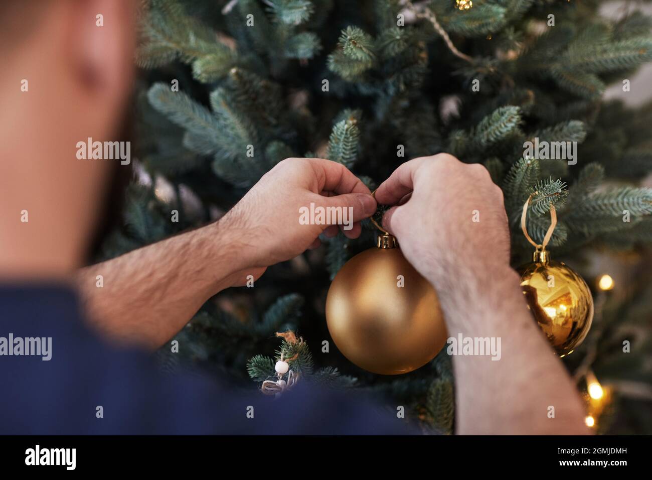 Man hanging tree branch hi-res stock photography and images - Alamy