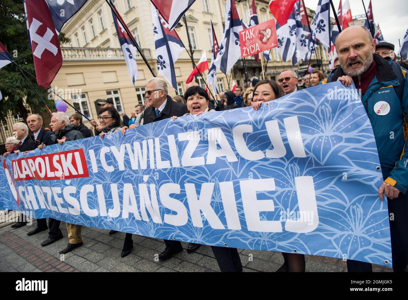 Warsaw, Poland. 19th Sep, 2021. Marchers wave flags and hold a banner during the demonstration.Thousands of people took part in the XVI National March of Life and Family (Narodowy Marsz Zycia i Rodziny) in Warsaw which was held under the slogan 'Dad - be, lead, protect'. As the organizers of the event announced earlier, it was aimed at manifesting pro-family attitudes and pro-life values. The event's main organizer was the Center of Life and Family. (Photo by Attila Husejnow/SOPA Images/Sipa USA) Credit: Sipa USA/Alamy Live News Stock Photo
