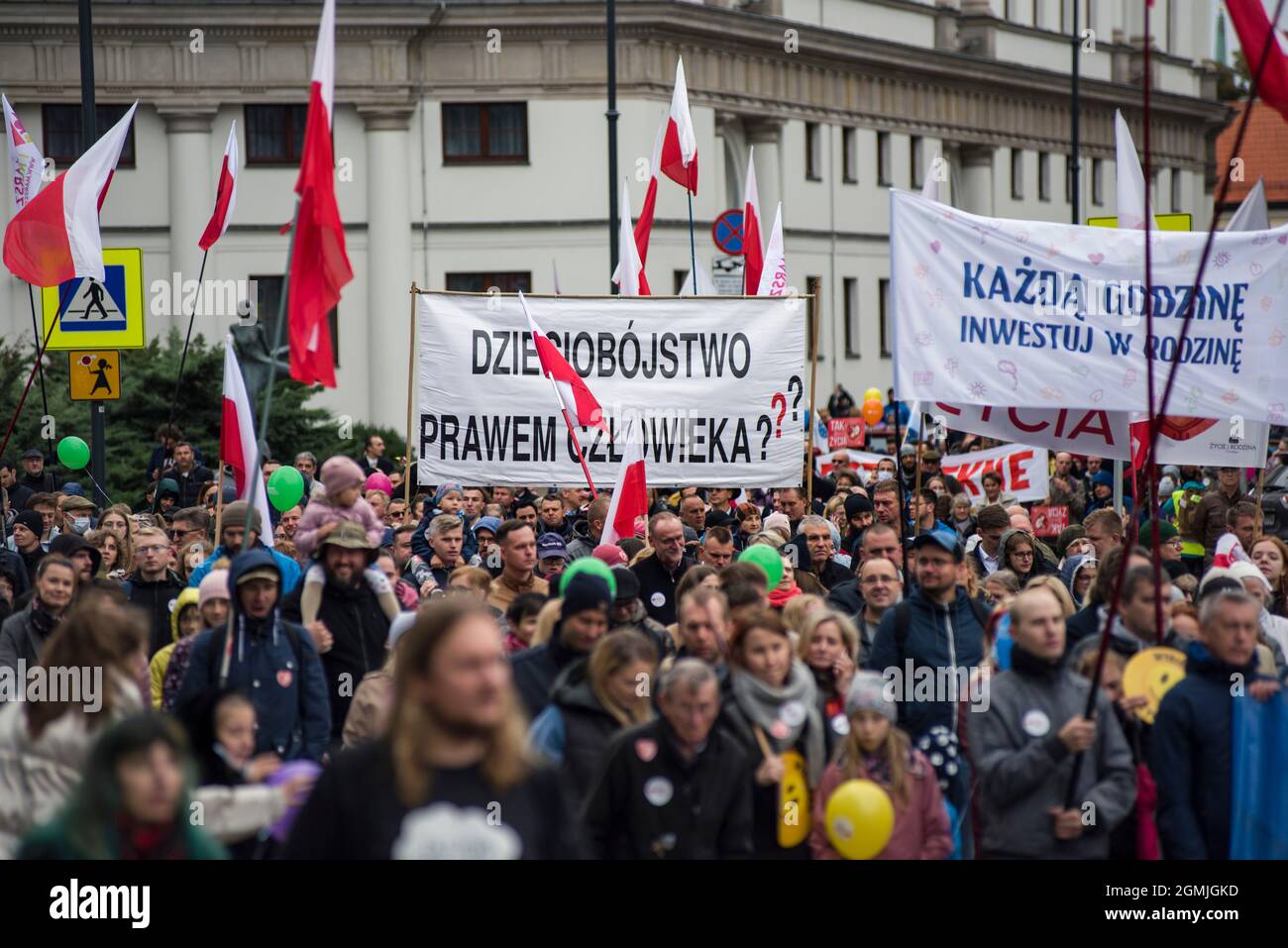 Warsaw, Poland. 19th Sep, 2021. Marchers wave flags during the rally in Warsaw.Thousands of people took part in the XVI National March of Life and Family (Narodowy Marsz Zycia i Rodziny) in Warsaw which was held under the slogan 'Dad - be, lead, protect'. As the organizers of the event announced earlier, it was aimed at manifesting pro-family attitudes and pro-life values. The event's main organizer was the Center of Life and Family. (Photo by Attila Husejnow/SOPA Images/Sipa USA) Credit: Sipa USA/Alamy Live News Stock Photo