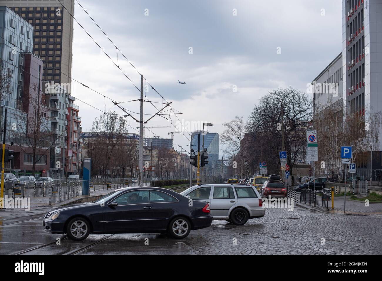 Cars driving in the rain in Sofia Bulgaria Stock Photo Alamy