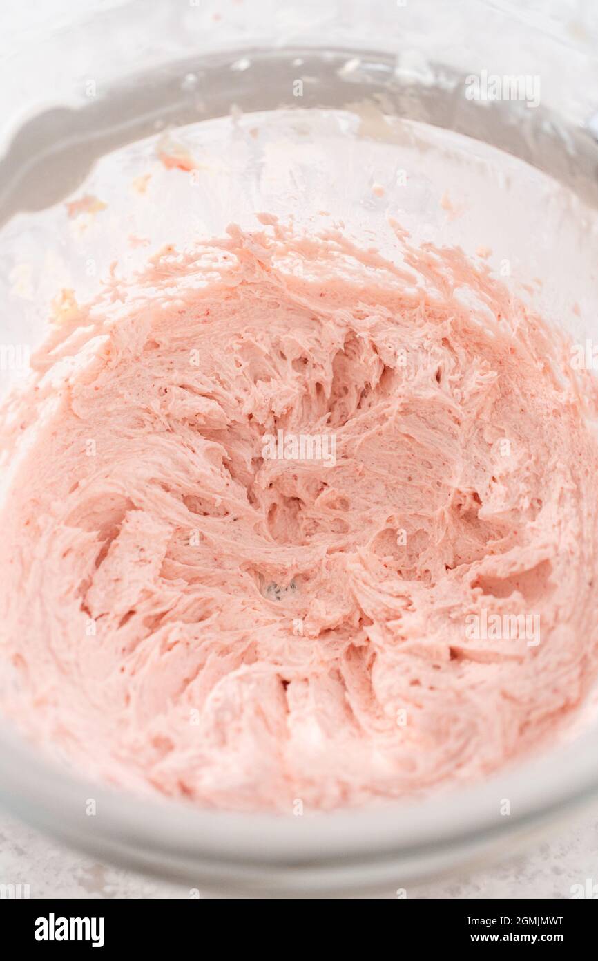 https://c8.alamy.com/comp/2GMJMWT/whipping-strawberry-buttercream-frosting-in-a-stand-alone-electric-mixer-with-a-whisk-attachment-2GMJMWT.jpg