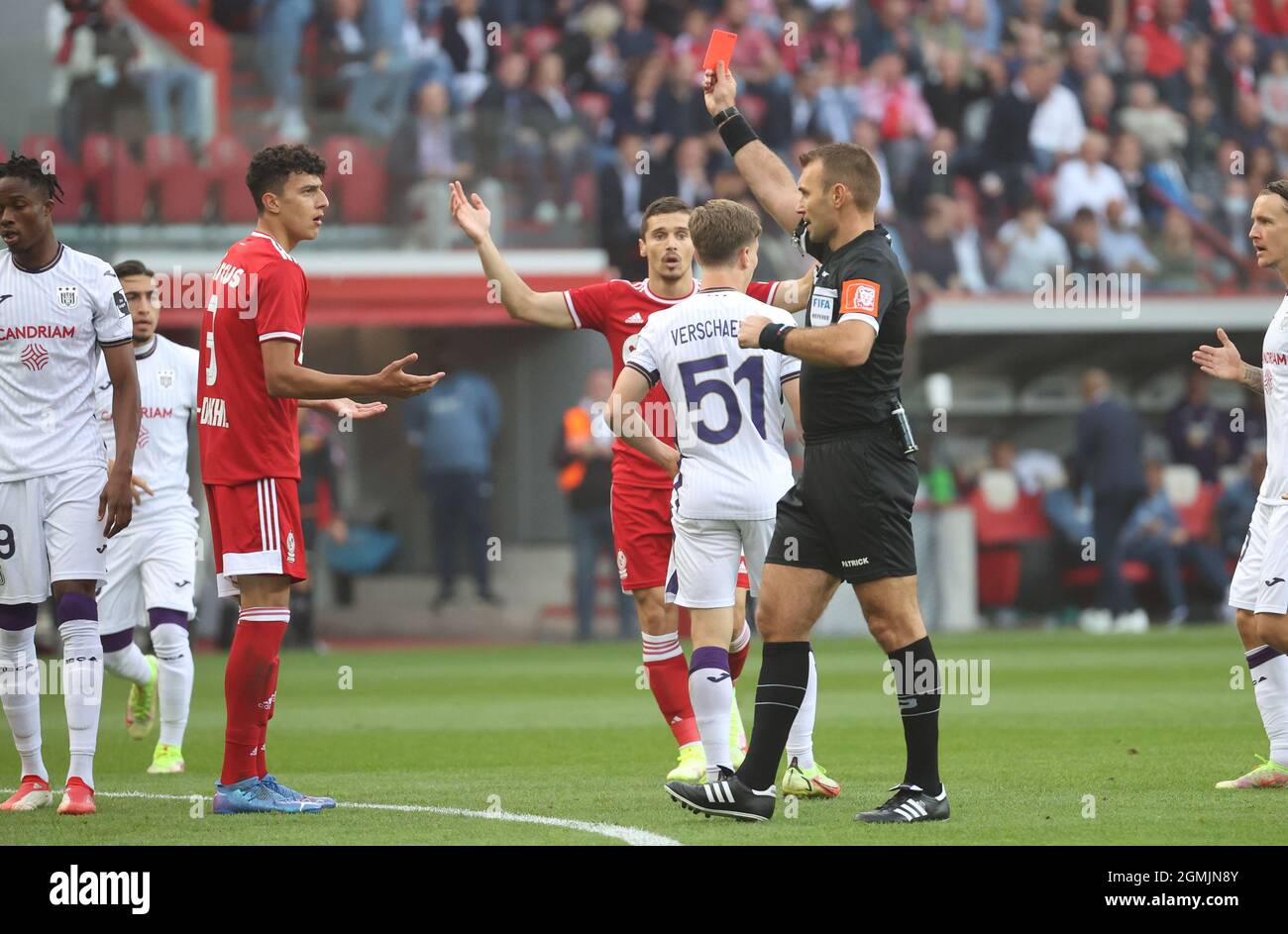 Standard's Amee Al-Dakhil receives a red card from referee Nicolas Laforge during a soccer match between Standard de Liege and RSC Anderlecht, Sunday Stock Photo