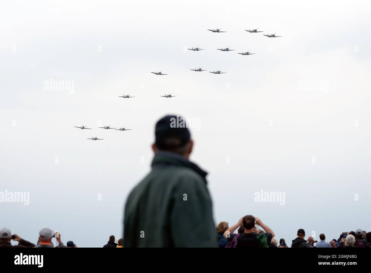 A wing of eleven Supermarine Spitfire's and four Hawker Hurricane's display during the Battle of Britain Air Show at IWM Duxford. Picture date: Sunday September 19, 2021. Stock Photo