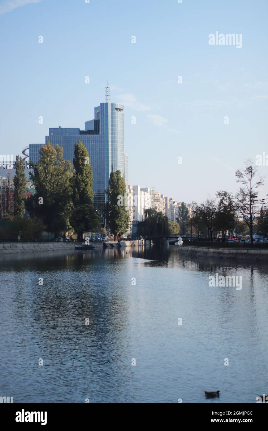Building by the water, lake, beautiful city view, daytime Stock Photo