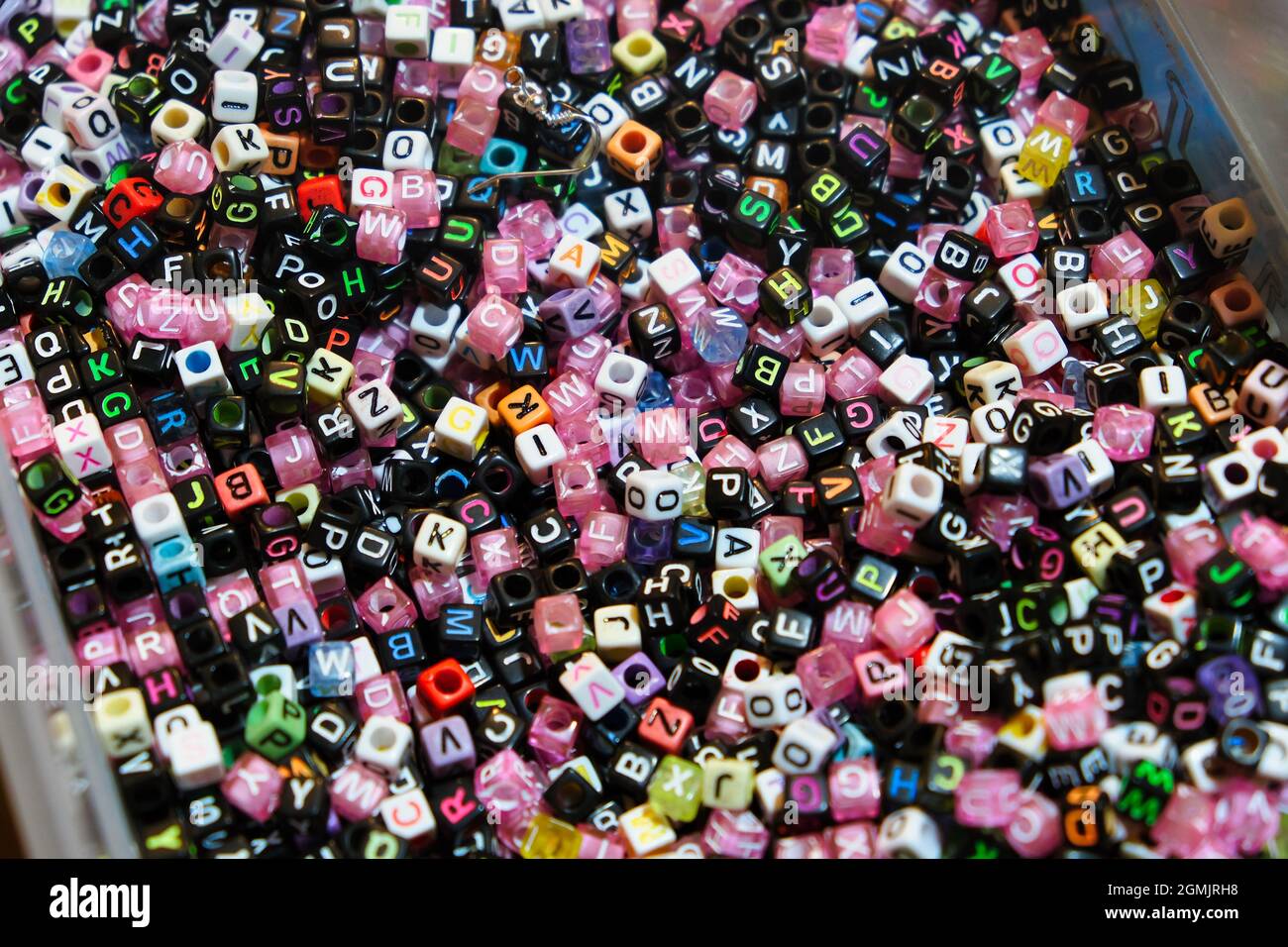 Close up of beads with colorful letters Stock Photo